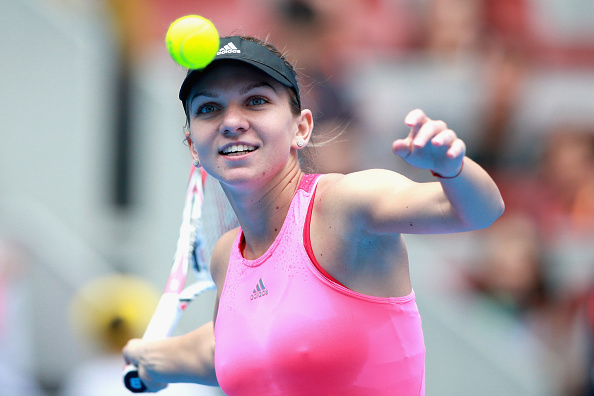 BEIJING, CHINA - OCTOBER 02:  Simona Halep of Romania celebrates winning against Andrea Petkovic of Germany during day six of the China Open at the China National Tennis Center on October 2, 2014 in Beijing, China.  (Photo by Feng Li/Getty Images)